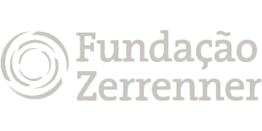 Logotipo da Fundação Zerrenner em cinza claro, exibido sobre fundo transparente. Composto por um ícone icônico que simboliza os valores e a identidade da fundação, seguido pelo nome “Fundação Zerrenner” em tipografia clara e moderna.