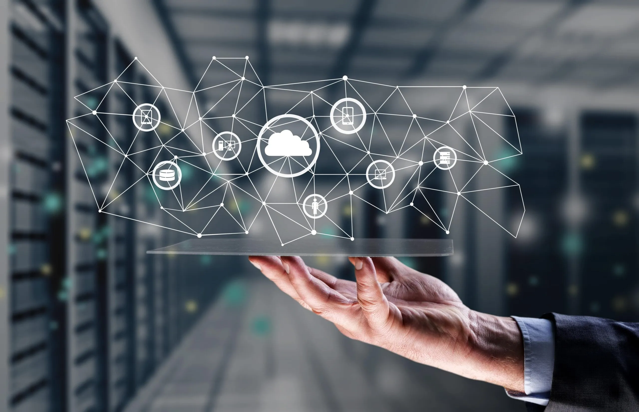 Cover image for "The top reasons why CIOs need to prioritize legacy modernization today," featuring a person holding an organizational chart on a tray. This organizational chart includes icons representing clouds, people, mobile devices, security, computers, and more.