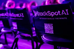 Cover of the article on StackSpot AI at Web Summit Rio 2025. The image shows a chair with a cover featuring StackSpot AI.